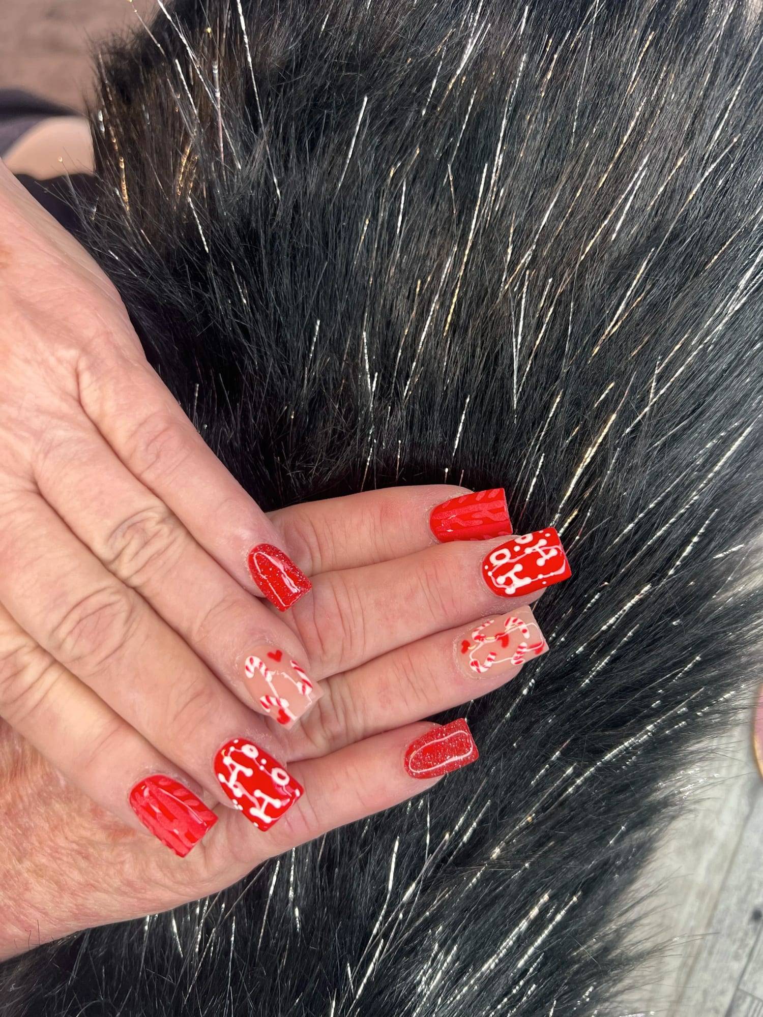 Short red holiday nails with hand-painted details