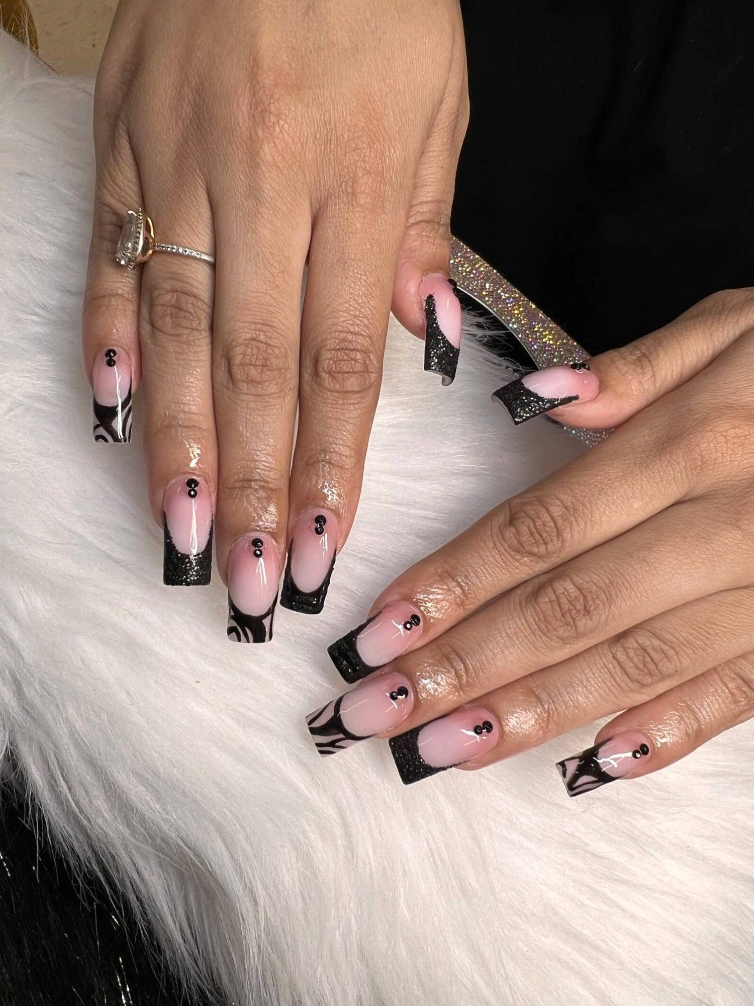 Pink coffin acrylics with black French tips and heart details
